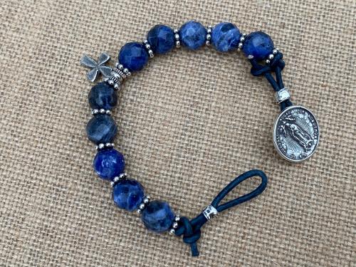 Sterling Silver Our Lady of Guadalupe Bracelet, Denim Blue Sodalite Gemstones, Antique Replica Medal, Button Closure, Dangling Cross Charm